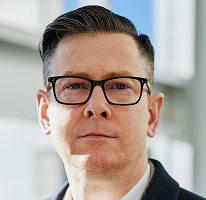CEO-portræt af Alexander Hughes, direktør i kryptohandelsvirksomhed